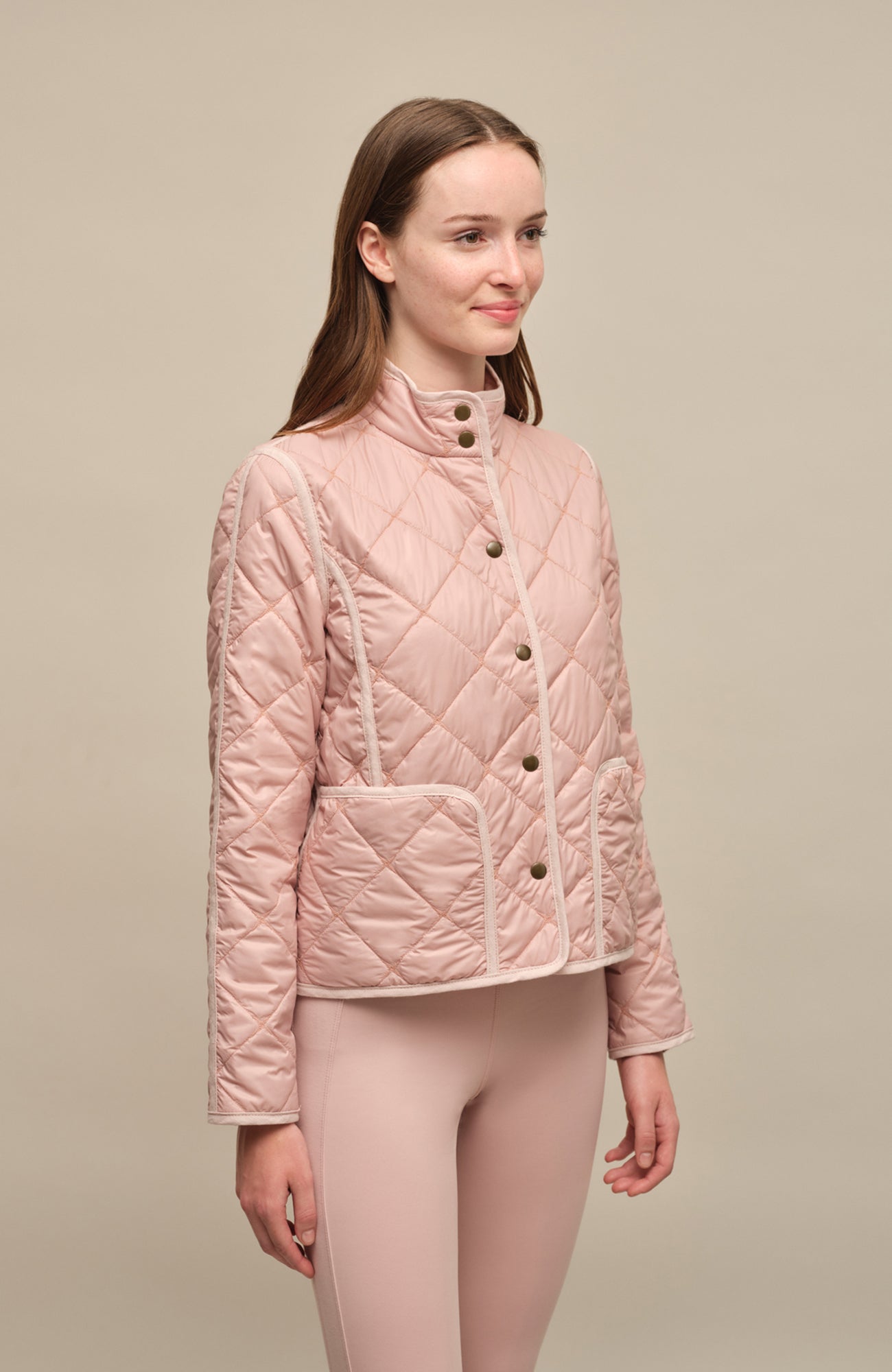 Quilted short jacket from Frauenschuh, Clara model, in dustyrose color. Stylish and lightweight with snaps, offering a relaxed fit and modern design.